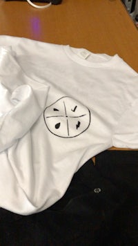 a white t - shirt on a table