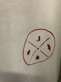 a piece of paper with a red stamp on it